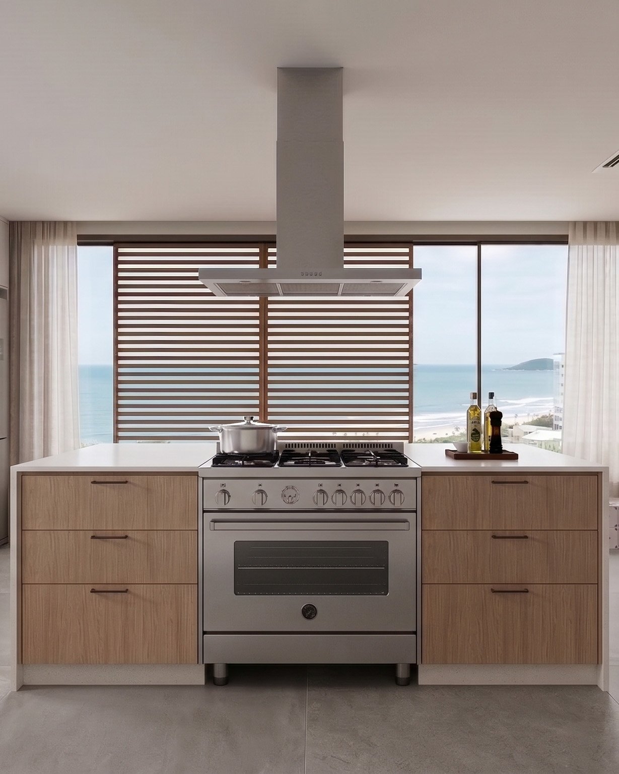 Ilha da cozinha pensada especialmente para valorizar a vista do mar em um apartamento em Itapema.